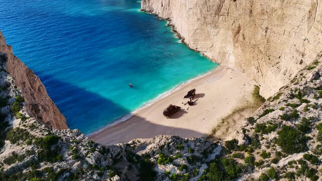 Aerial drone cinematic video of one of the most photographed beaches in the world called navagio or shipwreck a ship rest to rust ashore vanishing through the years, Zakinthos island, Ionian, Greece
