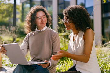 experts discuss sustainability, researchers collaborate on green projects amidst campus sunlight