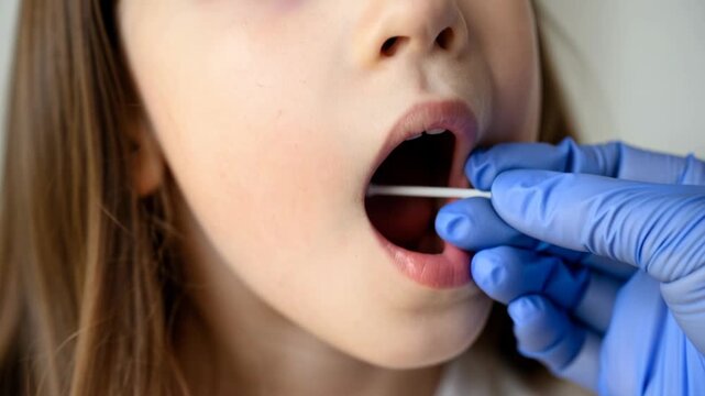 PCR test swab and child, kid opens mouth for diagnostics close-up, concept of covid, corona and school