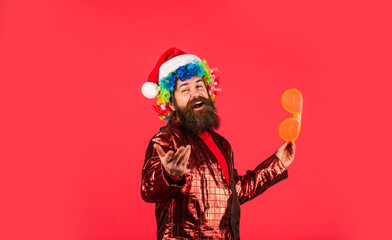 Merry Christmas. morning before Xmas. bearded man in party glasses. man in santa hat await christmas present. hipster enjoy the holiday. new year shopping idea concept. ready for party celebration