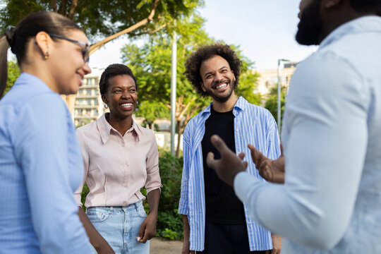 Business team having a discussion in a city park
