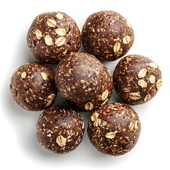 Arrangement of seven round treats with oats visible against a plain backdrop view