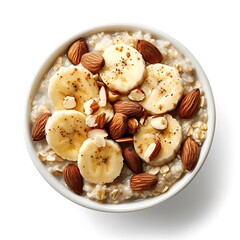 Oatmeal breakfast bowl topped with banana slices and almonds in a white bowl view from above