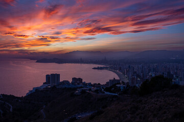 Benidorm cityscape at sunset showing colorful sky and coastline