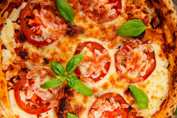 Pizza tomato margarita fast food natural product tasty snack fresh delicious gourmet food background on the table rustic top view copy space