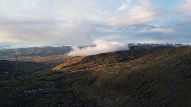 Ausangate, Peru: Aerial drone footage of sunset over Pacchanta, village in Peru where Ausangate mountain trek starts. Taken with forward motion showing sunset on the landscape