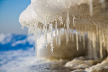 icicles hanging from a frozen sea wave