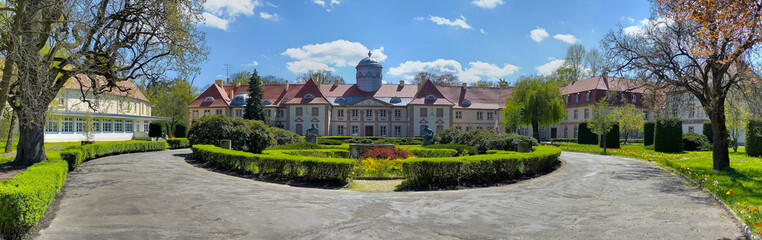 Stunning manor house with manicured hedges garden, Milicz, Poland