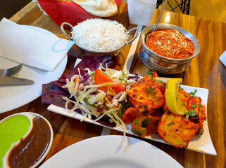 Delicious Indian dinner feast: Rice, curry, and salad
