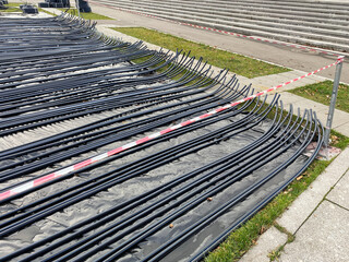 Construction site of temporary outdoor ice rink with pipe grid. Early stage of pop-up ice rink...