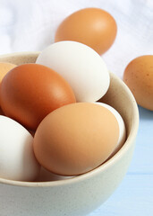 chicken eggs on a colored background. Farm products, natural eggs.. Vertical photo format