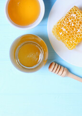 Fresh honey on the table close-up on a colored background. Vertical photo format