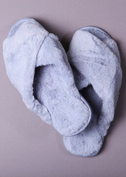 Home slippers close-up top view close-up on a colored background. Vertical photo format