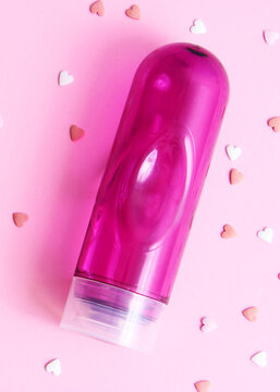 An intimate lubricant for comfortable sex close-up on a colored background.. Vertical photo format