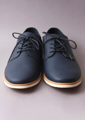 men's shoes on a colored background. men's office shoes.. Vertical photo format