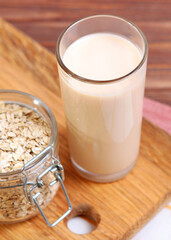 oatmeal milk on the table. Vegetable Milk, Vegetarian Milk.. Vertical photo format