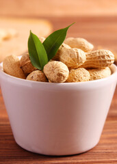 peanuts on a light background close-up. nuts. Vertical photo format