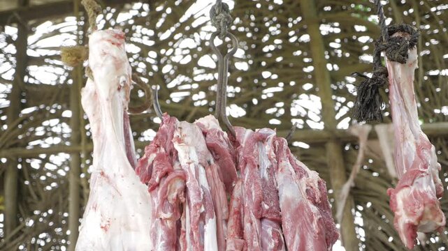 Freshly Cut Beef Hanging in a Traditional Butcher Shop