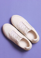 women's sneakers on a colored background top view. Women's shoes.. Vertical photo format