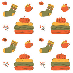 Flat illustration of sweater pile, pumpkins, socks, mug with whipped cream. Seamless vector pattern with cozy autumn elements. Seasonal design for background, fabric, wrapping paper, or packaging.