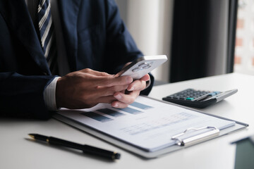 Business people using smartphone while working  in office