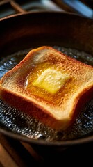 Toast square frying in bubbling butter