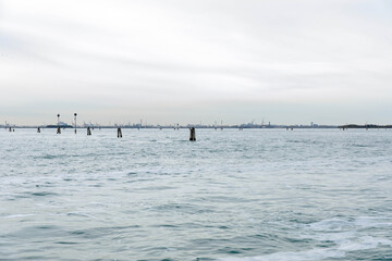 Serene ocean view with distant horizon and calm waters under overcast sky