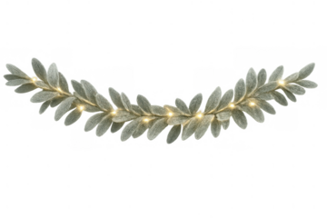 Christmas decoration with frosted lamb's ear leaves garland and warm string lights, creating festive atmosphere