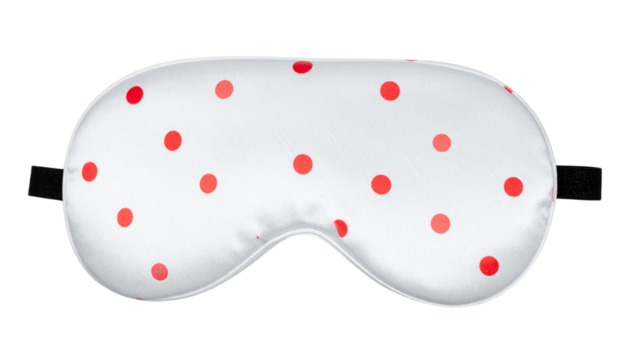 White eye sleeping mask with playful red dots, soft and cozy for restful sleep. Ideal for wellness, relaxation, travel, self-care, and lifestyle design projects.