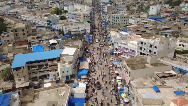 SENEGAL - 10.23.2025 - Excellent aerial footage of Muslim pilgrims walking and driving through Senegal for the Grand Magal of Touba.