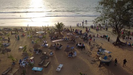 THE GAMBIA - 10.31.2025 - Terrific aerial footage moving along the coastline of the Gambia's Senegambia Beach at sunset.