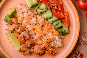 A food bowl with salmon, rice, avocado, tomatoes, and cucumbers. A salmon bowl