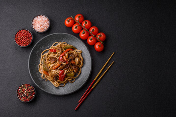 Asian food, noodles with vegetables, vegetarian dish with spicy sauce. Noodles with vegetables
