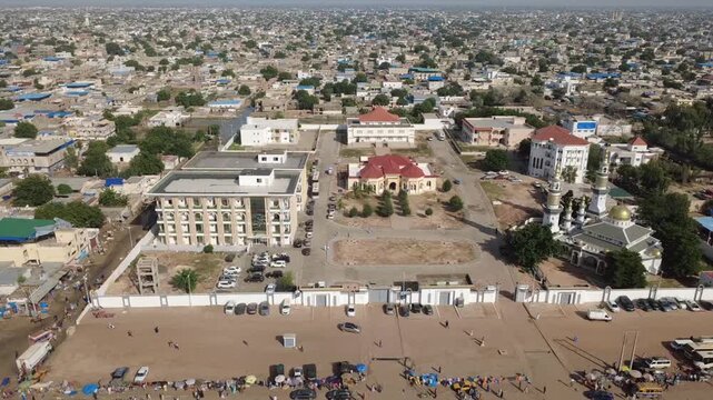 SENEGAL - 10.23.2025 - Wonderful aerial footage of Muslim pilgrims walking and driving down separate roads in Senegal for the Grand Magal of Touba.