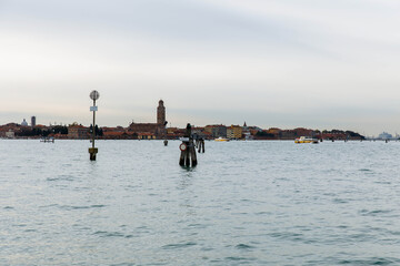 Murano, Italy - November 21, 2024: Scenic view of Murano Island with historic buildings and serene waters, showcasing the beauty of Venetian architecture and tranquil ambiance