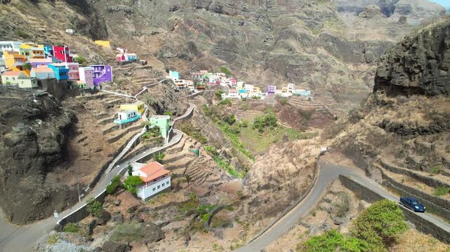 CAPE VERDE - 9.4.2025 - Good aerial tilt up colorful housing on the hills of Cape Verde's Fontainhas village.