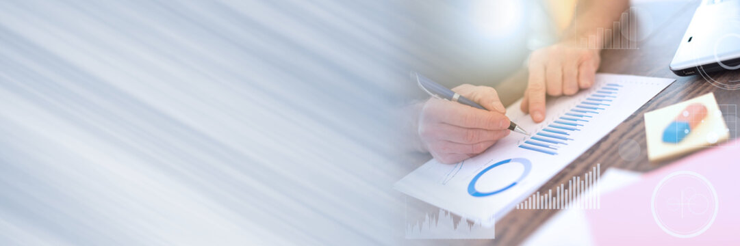 Man working on financial graphs, double exposure, light effect; panoramic banner - Powered by Adobe