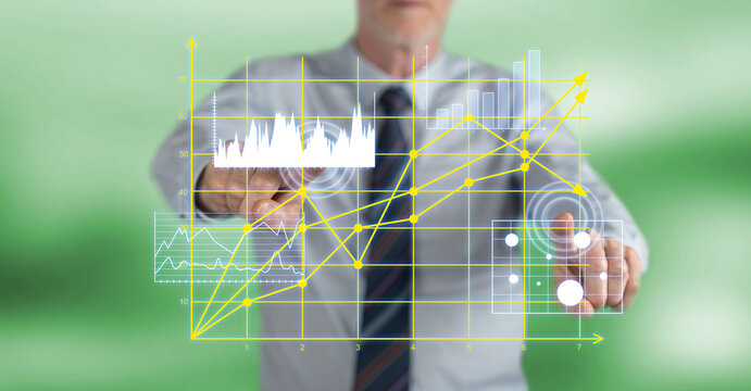 Man touching business charts