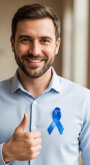 Smiling man showing blue ribbon and thumbs up gesture, Blue November, Men's Health Awareness 