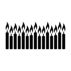 Row of lit birthday candles silhouette