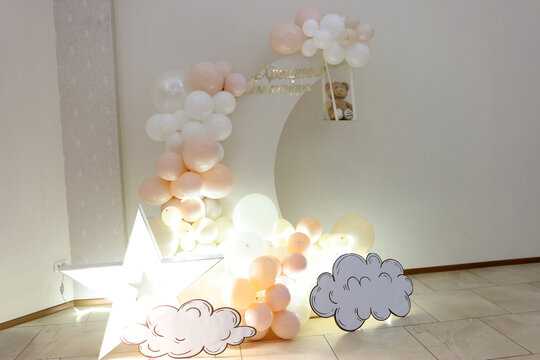 Children's background for a baptism celebration made of balloons in pastel colors.