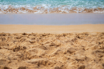 Waves rolling in on sand proportioned