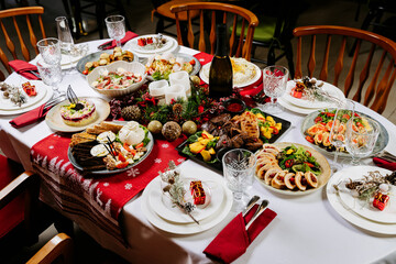 Festive Christmas dinner table with traditional holiday dishes and elegant table setting