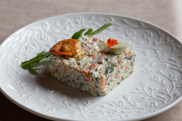 Olivier salad, vinaigrette salad and tartlets. Traditional russian appetizer for celebrating new year eve. Festive table setting.