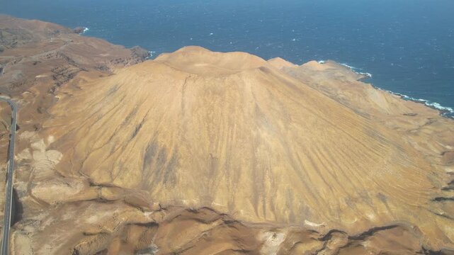 CAPE VERDE - 9.4.2025 - Stunning aerial footage circling counterclockwise around the Shark Mountain volcano on the coast of Cape Verde's Santo Antao island.