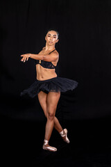 Fototapeta premium Timeless Elegance: Ballerina in Dramatic Studio Shadows