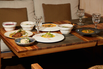 Indulge in Delicious Gourmet Dishes Beautifully Served at a Cozy and Inviting Table Setting