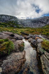 Fototapeta premium Beautiful mountain landscape with dramatic cloudy sky