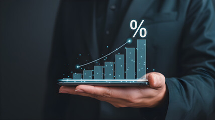 Business man showing a growing financial chart on phone
