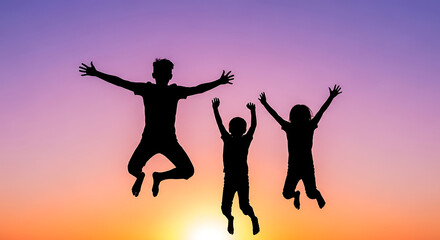 Fototapeta premium Silhouette of three children jumping with joy against a sunset sky